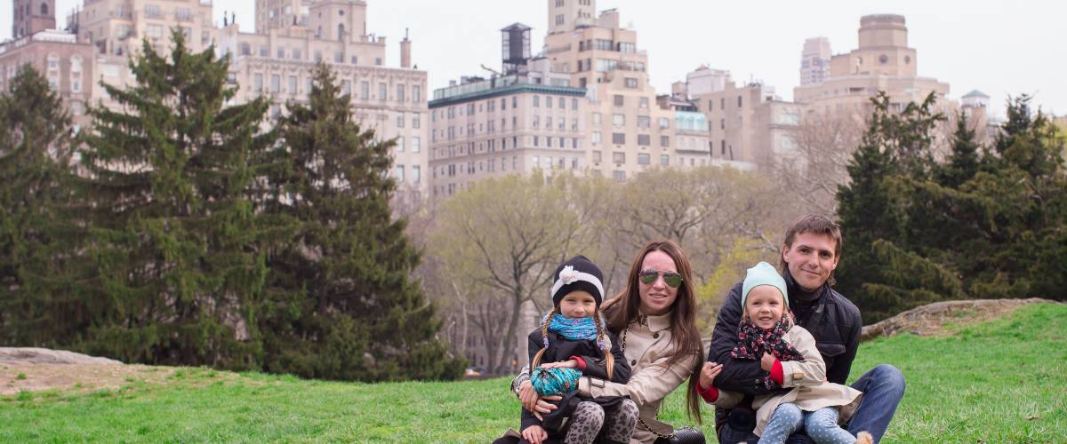 Family sitting in Central Park