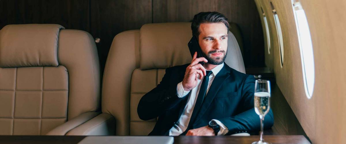 Businessman flying on his private jet