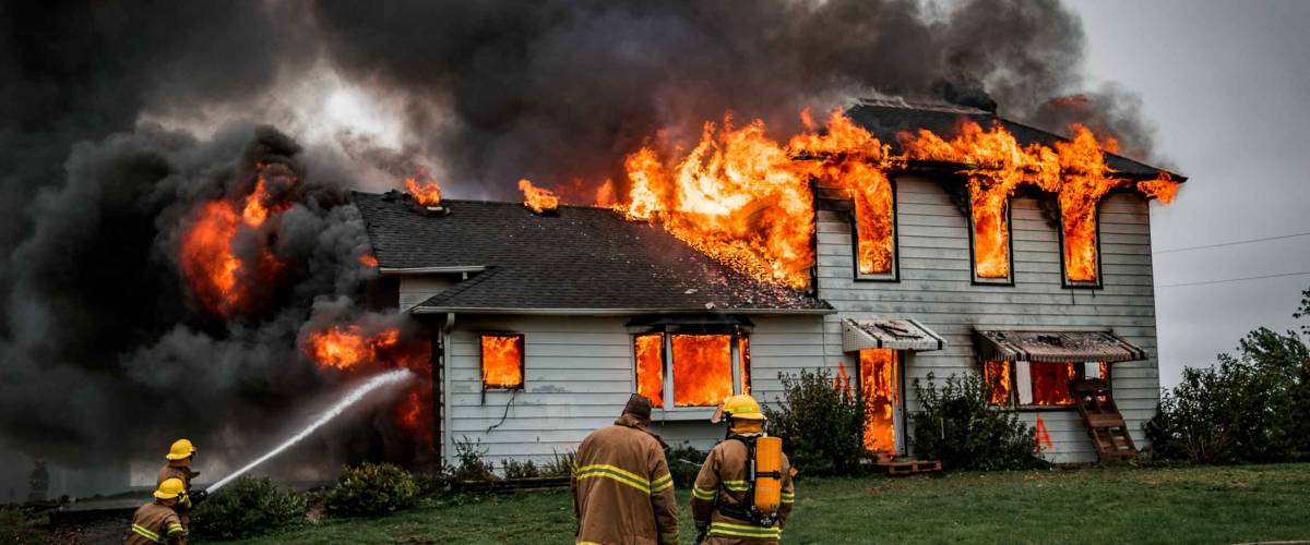 Fire Fighters Putting Out A House Fire