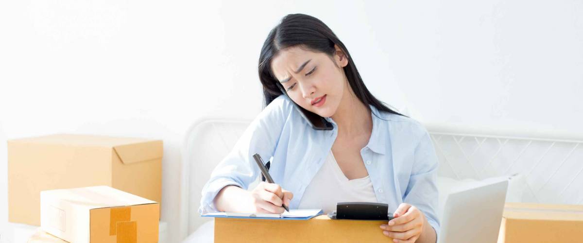 Young Asian Woman Working at home, Young Owner Woman annoyed customer and working with boring emotion. People with online shopping SME entrepreneur or freelance working concept.