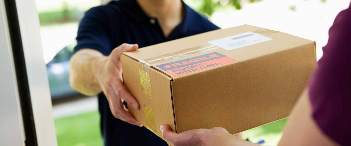 Delivery: Man Delivering Package To Homeowner