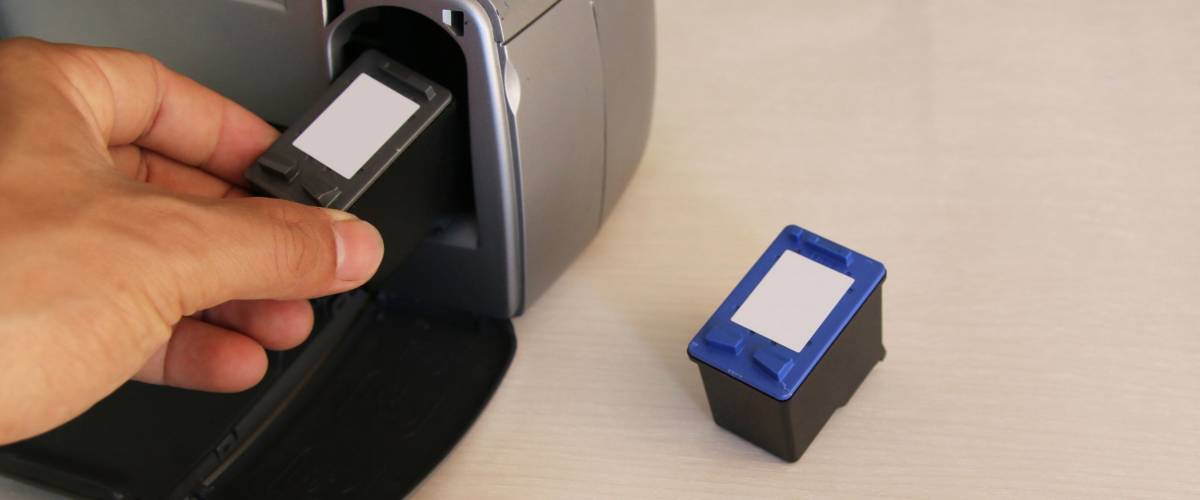 Man put Ink cartridges in printer