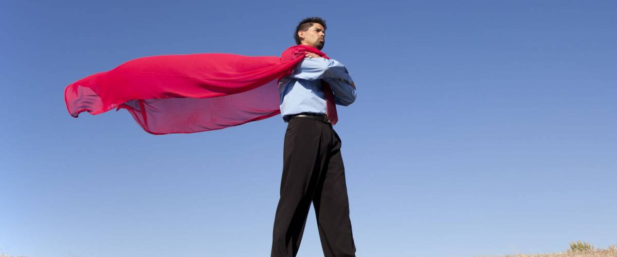 Businessman with a red flying cape like superman