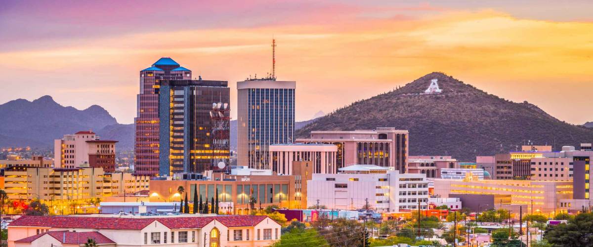 Tucson, Arizona, USA downtown skyline with Sentinel Peak at dusk.