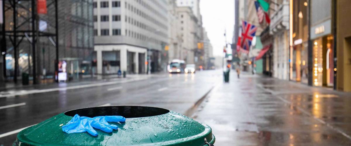 Used glove on empty street of New York City during Coronavirus quarantine lockdown