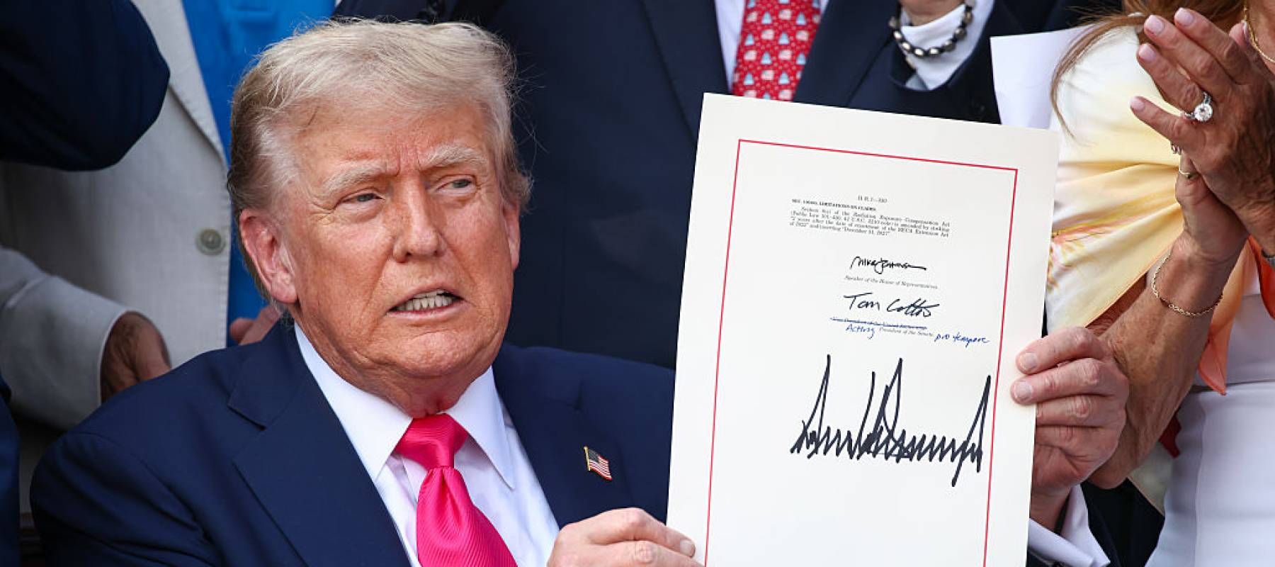 U.S. President Donald Trump, joined by Republican lawmakers, signs the One, Big Beautiful Bill Act.