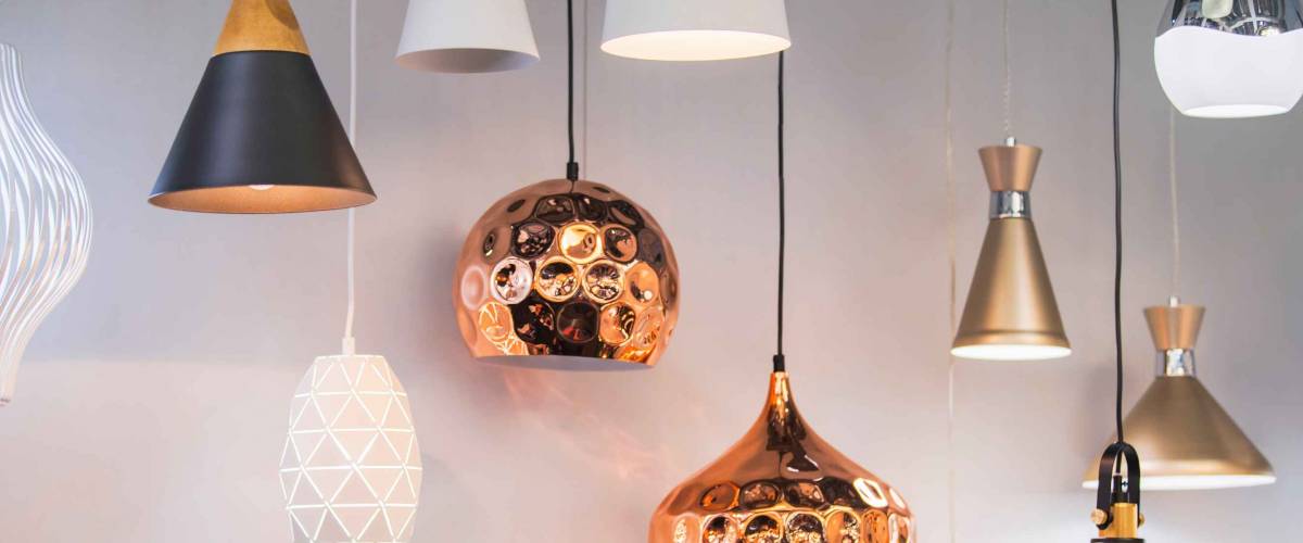 Different modern copper chandeliers.