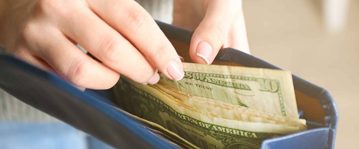 Girl with blue wallet full of money