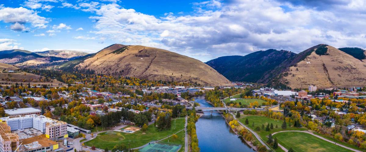 This is an aerial panoramic next the Higgins Street Bridge in Missoula, Montana on a beautiful fall day in Western Montana. You can see the M on Mount Sentinel and L on Mount Jumbo.