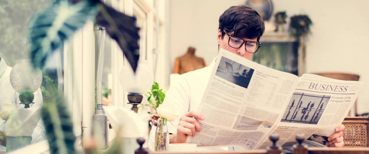 Reading newspaper