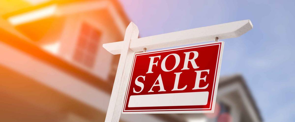 Home For Sale Real Estate Sign in Front of New House.