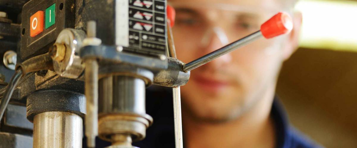 Young worker working in workshop