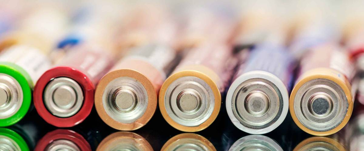 Closeup of pile of used alkaline batteries.