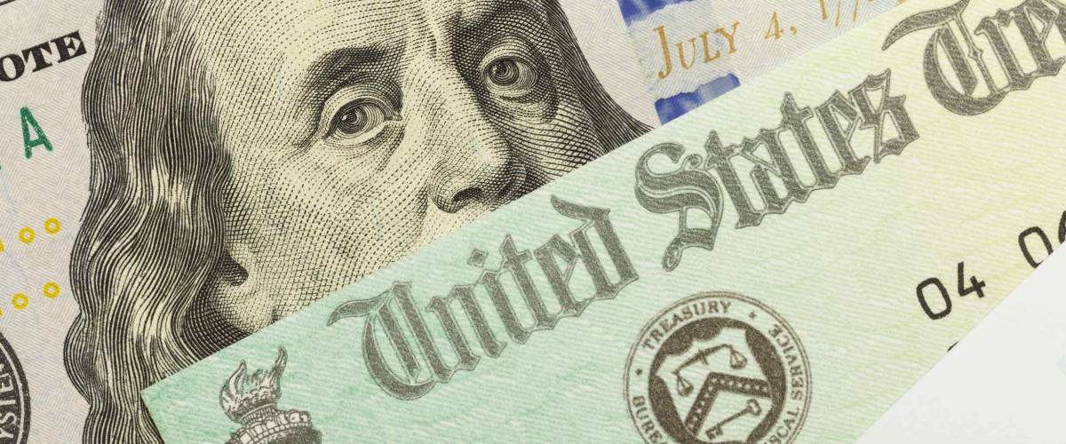 1040 Tax Form with Refund Check and Cash.