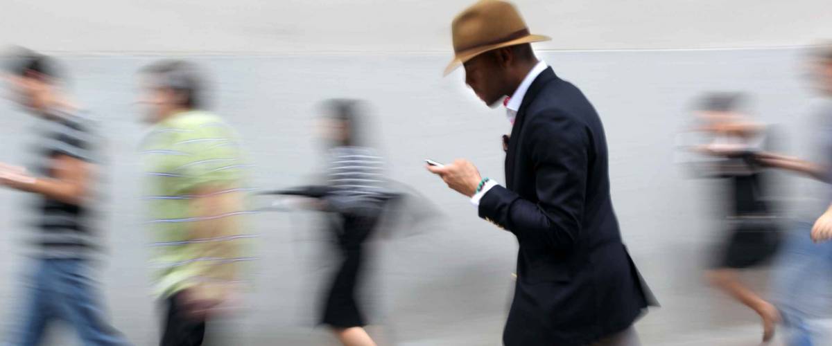Business people at rush hour walking in the street, in the style of motion blur