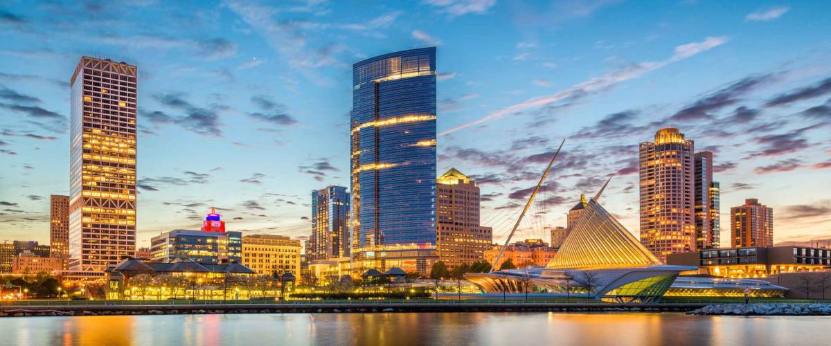Milwaukee, Wisconsin, USA downtown city skyline on Lake Michigan at twilight.