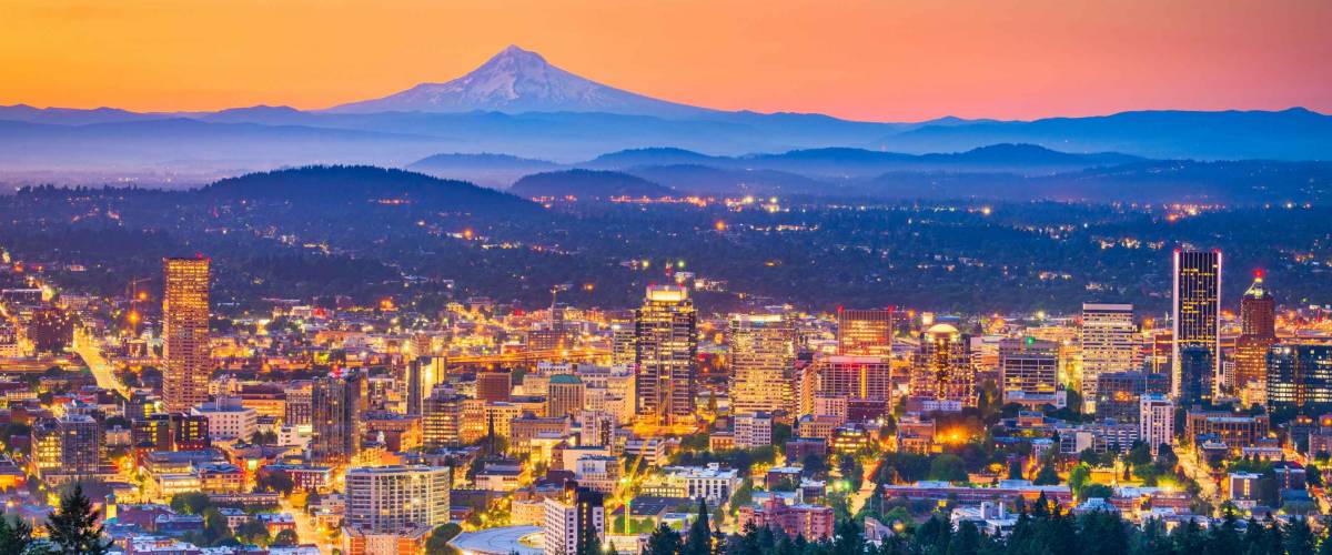 Portland, Oregon, USA skyline at dusk with Mt. Hood in the distance.
