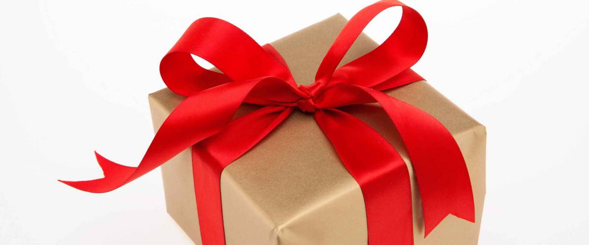 Golden gift box with red ribbon