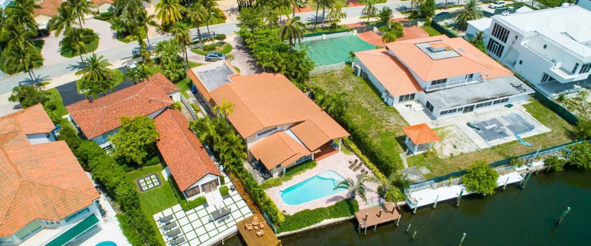 Aerial drone image of waterfront Miami Beach homes on the water