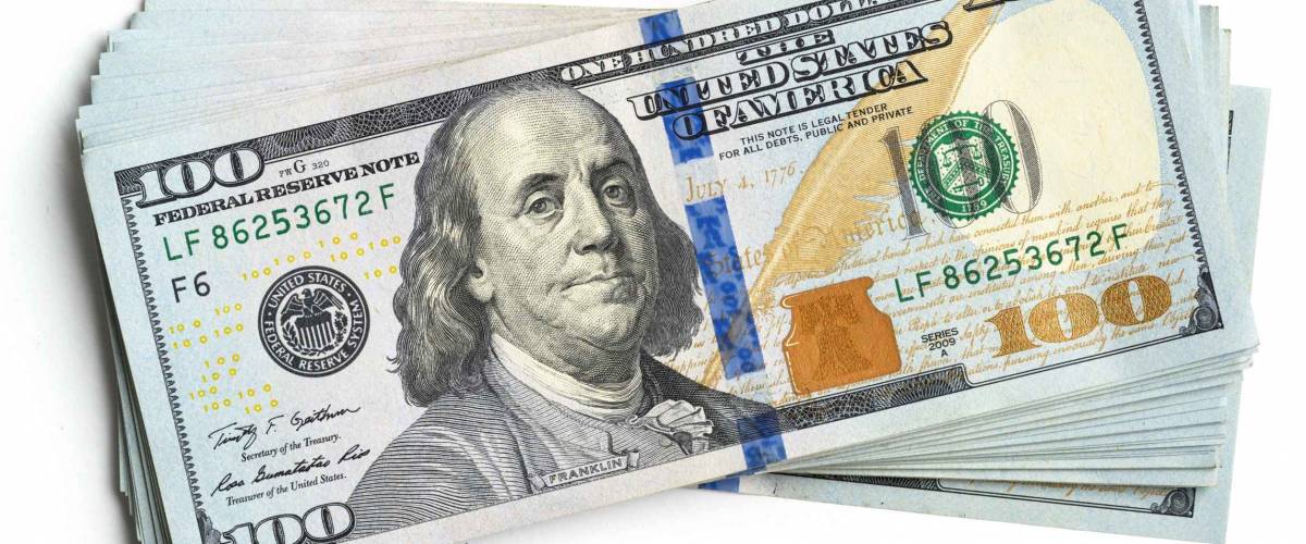 scrolled stack of dollar bills