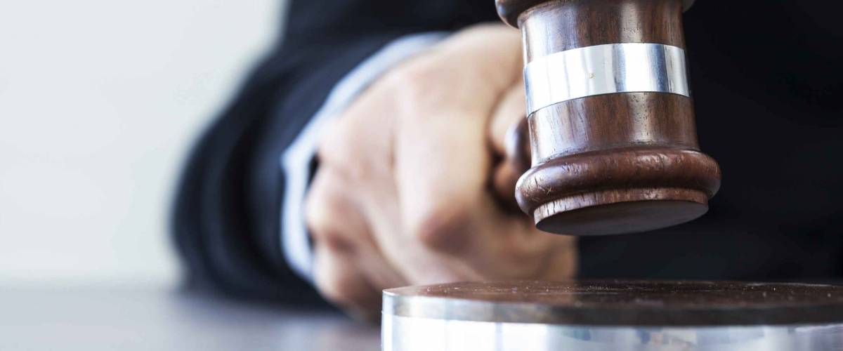 Judge with gavel on table
