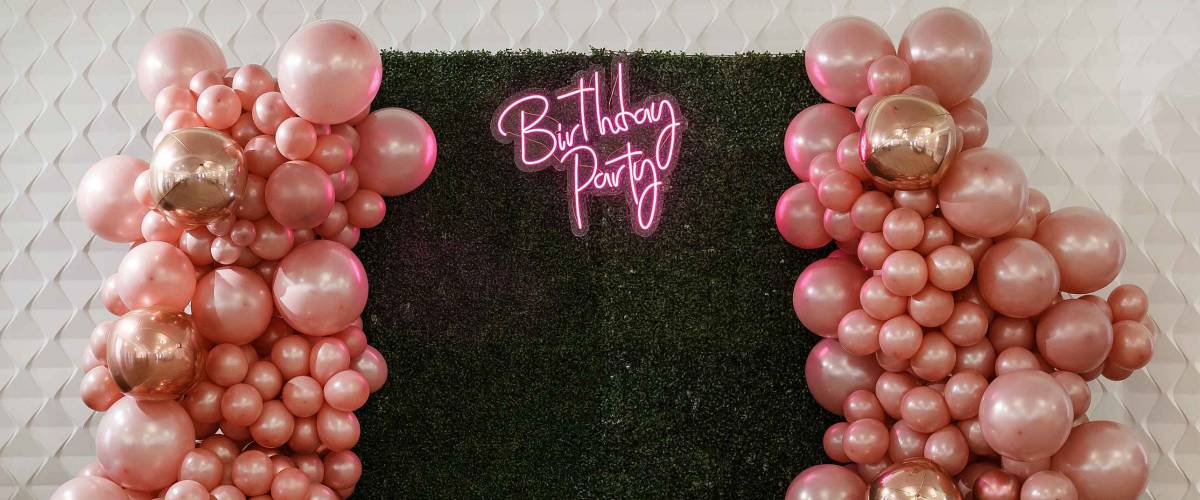 decor with balloons of pink , gold and rose gold collars/ text birthday party