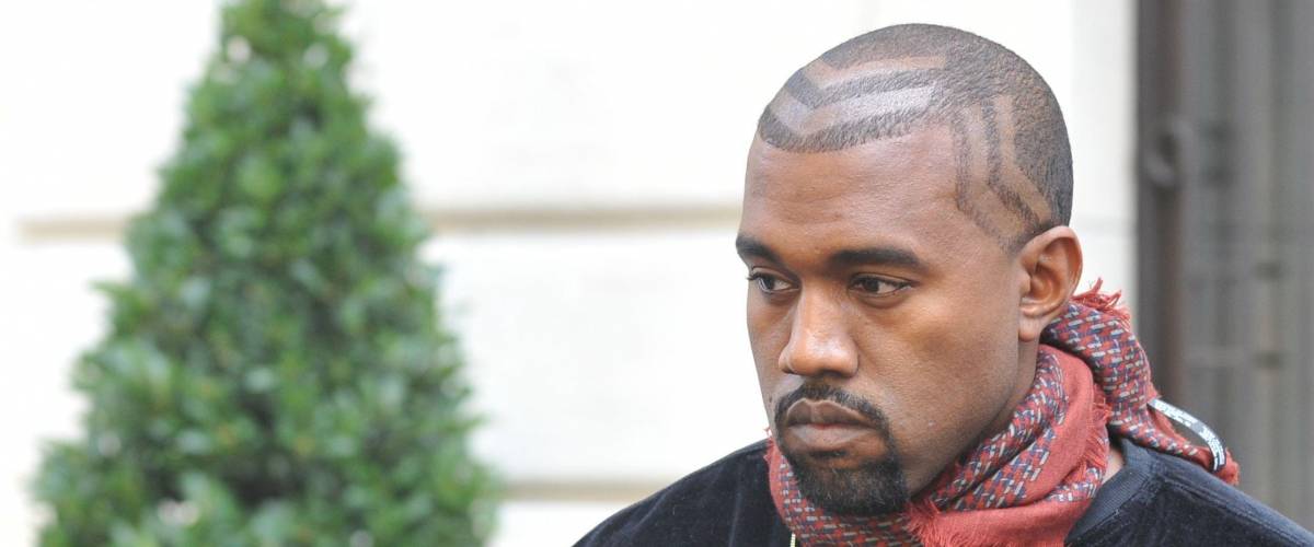 Kanye West wears a $500 haircut.