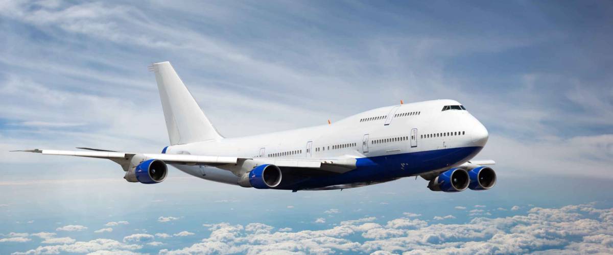 Passenger jet plane in the sky. Airplane flies high above the clouds.