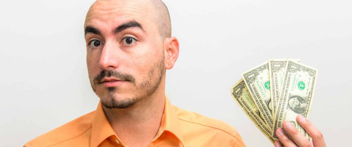 Men portrait with his few dollars left