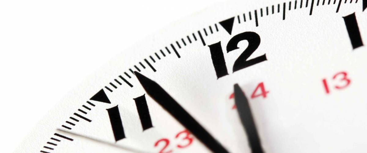 Closeup view of watch face on white