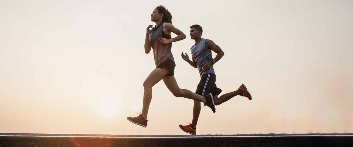 Young couple running on the street be running for exercise. fitness, sport, people, exercising ,running and lifestyle concept .
