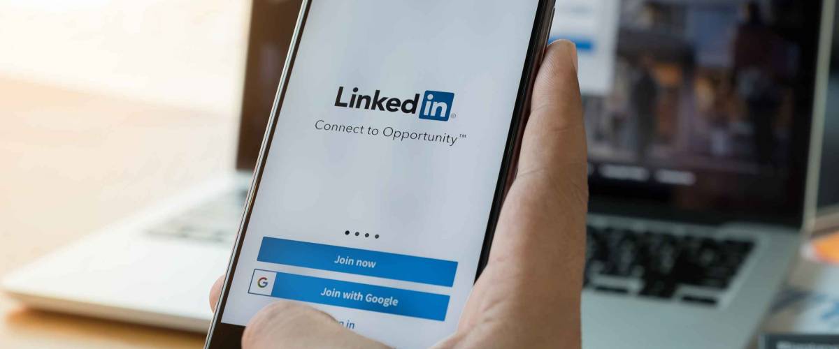 LinkedIn application on the screen. LinkedIn is a business-oriented social networking service.