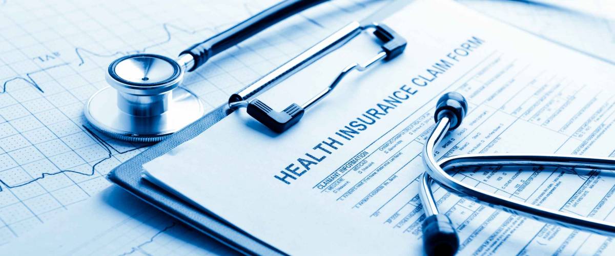 Health insurance form with stethoscope concept for life planning. Blue toned