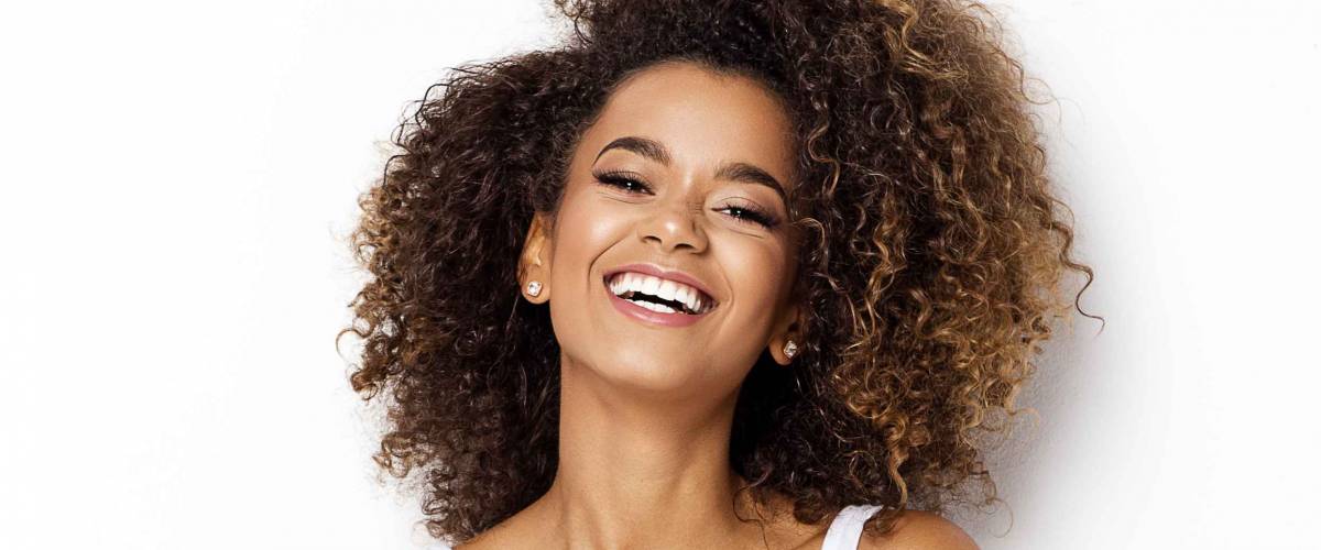Beautiful african american girl with an afro hairstyle smiling