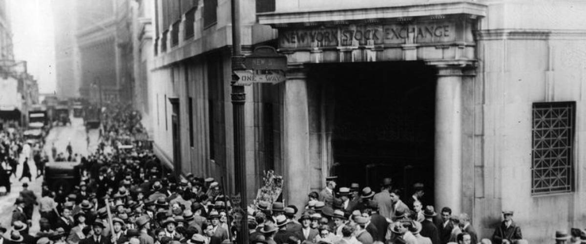 Stock traders gather outside the New York Stock Exchange