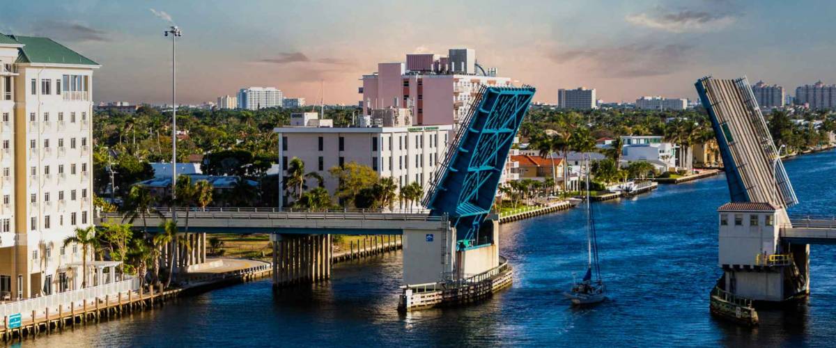 A Sailboat Motoring Through an Open Drawbridge in Fort Lauderdale