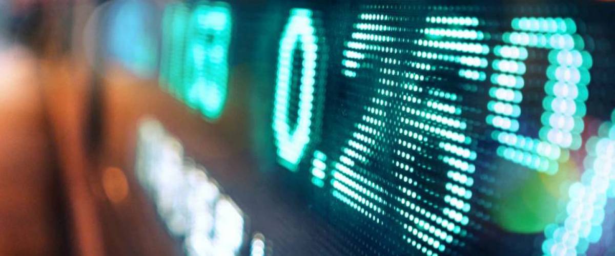 neon ticker with number percentages written across