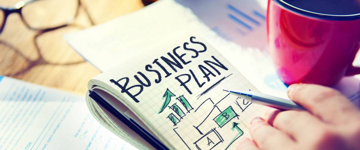 Businessman Writing Business Plan Growth Concept