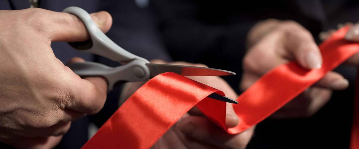 Business people hands cutting red ribbon close-up, new project, opening ceremony, stock footage