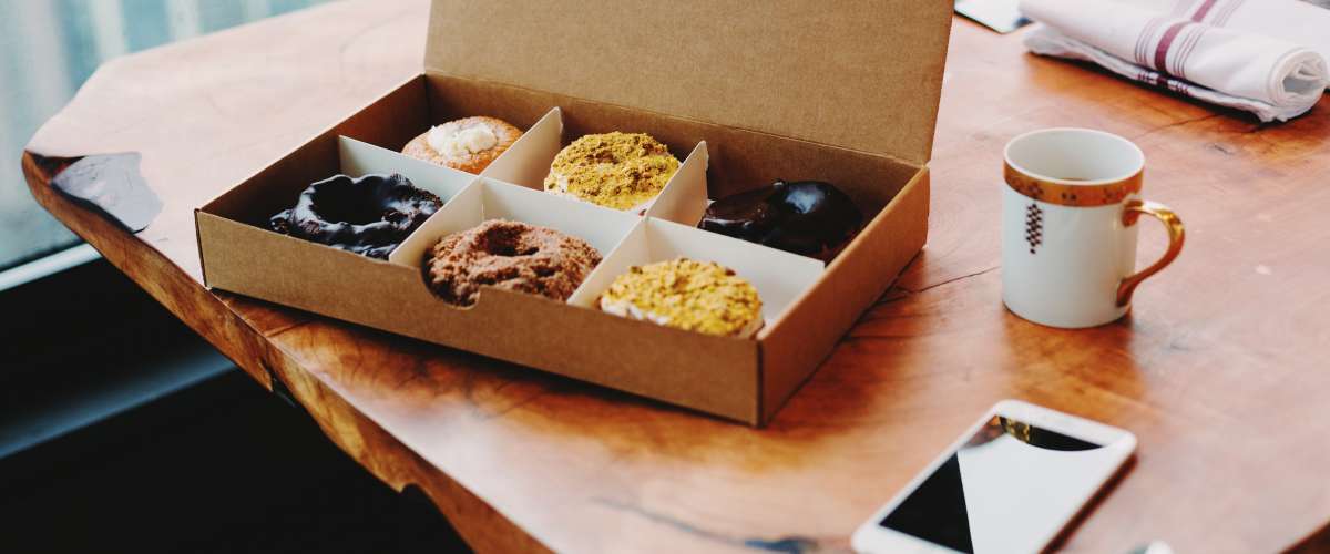 Donuts on a wood conference table