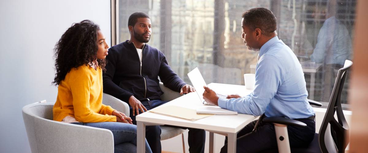 Couple meeting with advisor