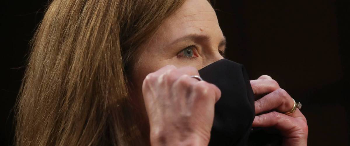 Amy Coney Barrett puts on a mask