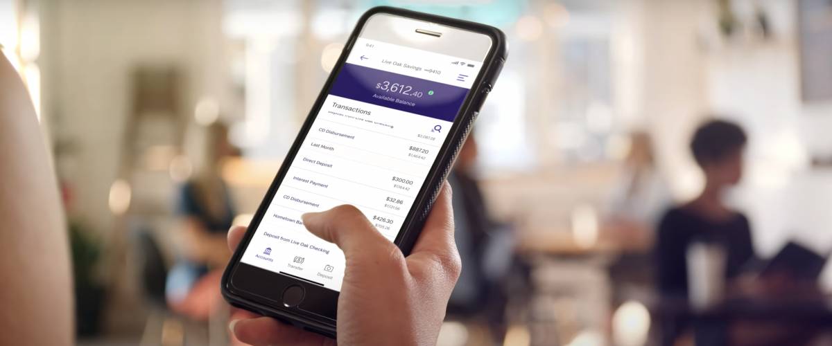 A woman scrolls through the Live Oak Bank app.