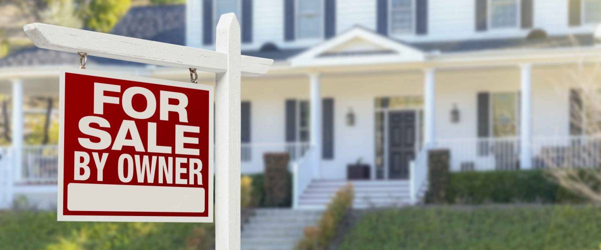 For Sale By Owner Real Estate Sign and Big White House