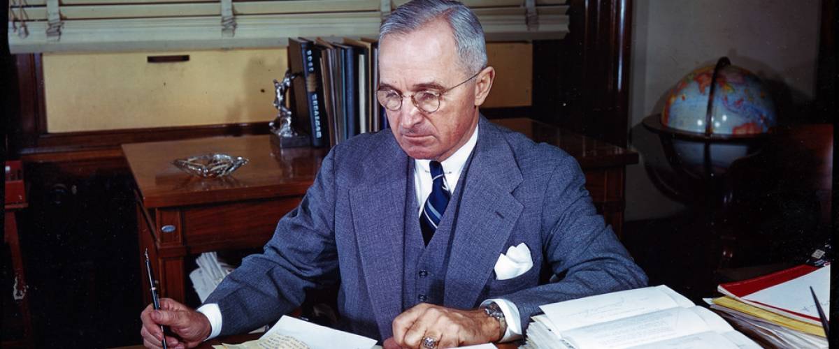 Former president Harry S. Truman Seated at His Desk in his Senate Office