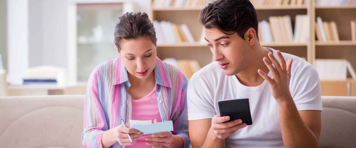 Young family discussing family finances