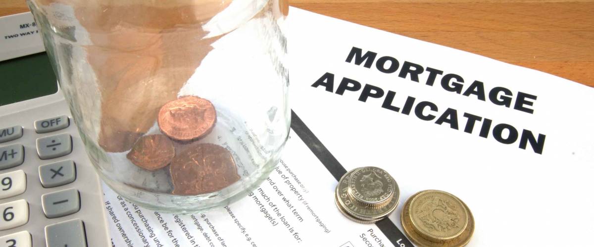 Mortgage application with coins and calculator