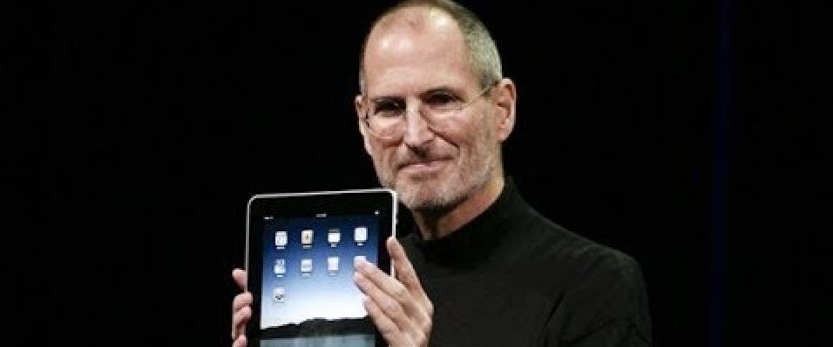 Steve Jobs holds up first generation iPad