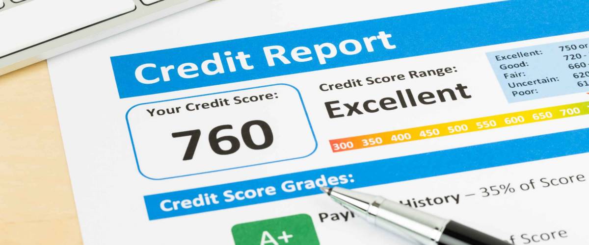 Credit score report with keyboard and pen