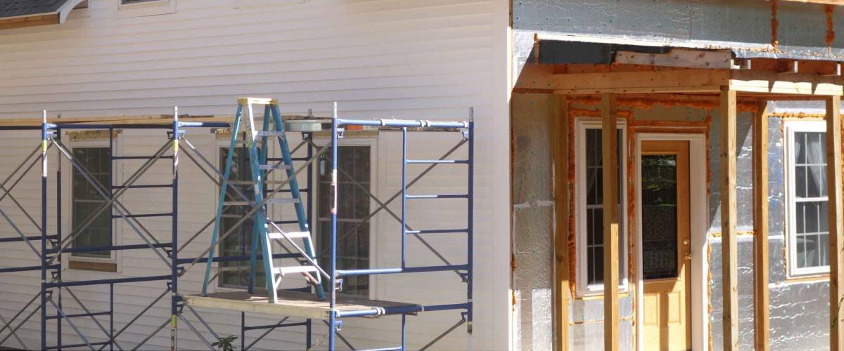 house remodeling with new siding and new porch and door
